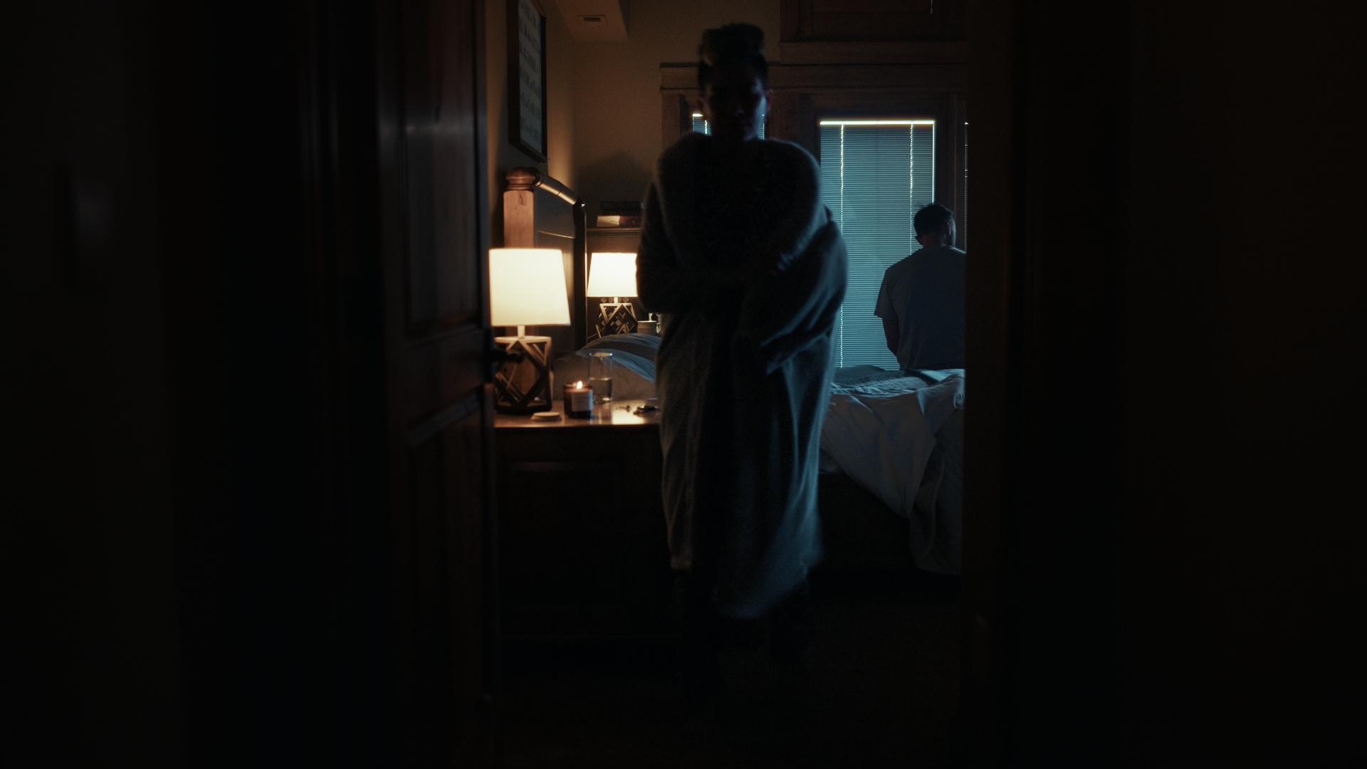 Core PT - A woman gets out of bed, feeling uncomfortable in a cinematic image still from a commercial